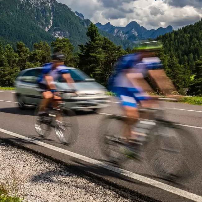 cyclists-riding-a-bicycle-on-the-road